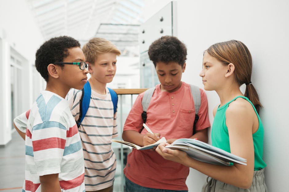 A group of multicultural students discussing and studying together indoors